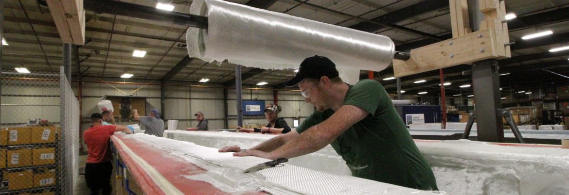 AIT Bridges employees at work on composite materials.