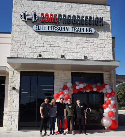 Core Progression Austin Gym with people out front for a group photo.