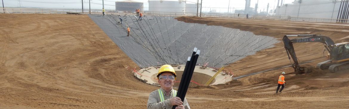 Zerust Oil & Gas employees working in a dirt area.