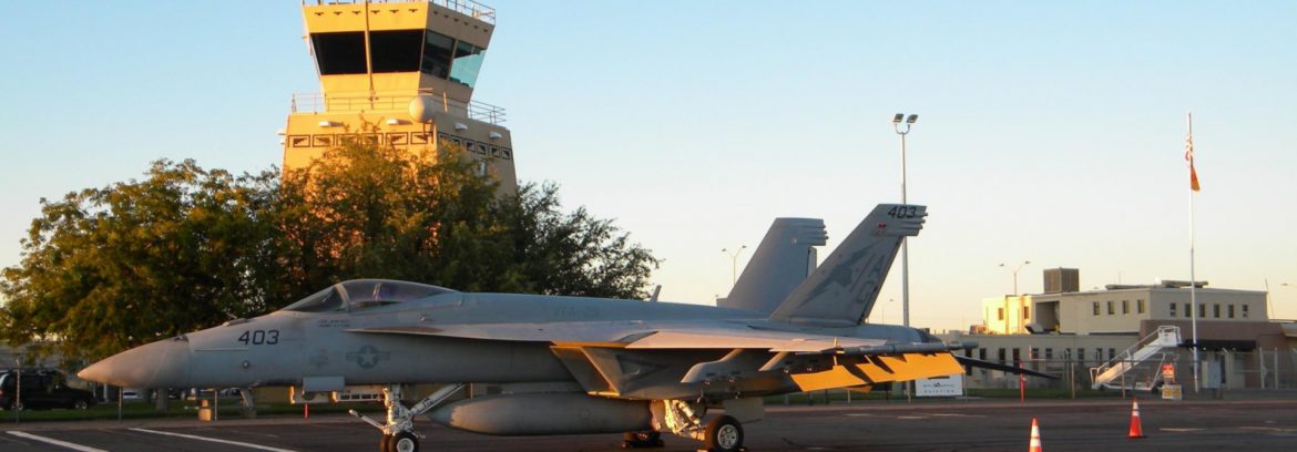 Four Corners Regional Airport jet in front of tower.