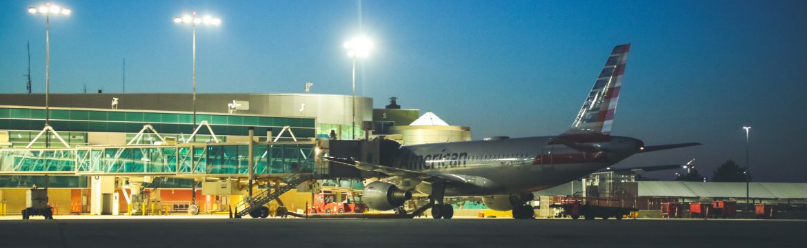 Rick Husband Amarillo International Airport plane at night with airport lights on.