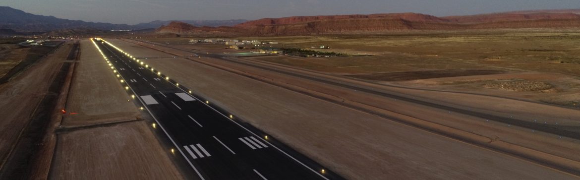 St. George Regional Airport view of runway at dusk with lights on.