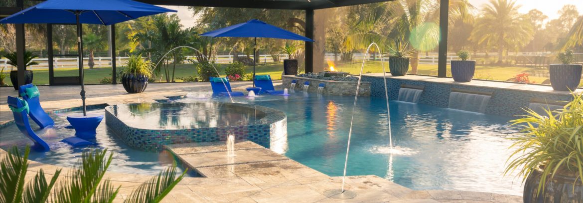 Superior Pools outdoor pool area with in water seating and a fountain.