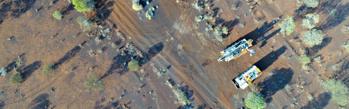 Element 25 Resource drilling aerial view showing trucks parked in a lightly wooded area.