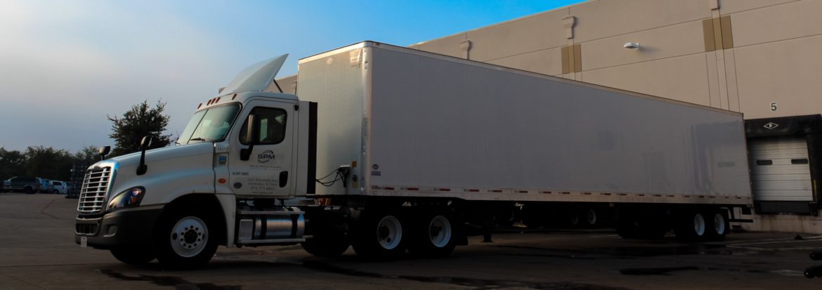 Special Products & Mfg., Inc. Delivery truck parked next to loading dock.