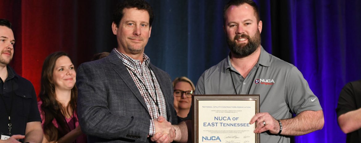 At NUCA’s 2020 Convention in Tucson, Arizona, the association formally added two new chapters, in East Tennessee and New Jersey. Membership growth is a top priority of NUCA CEO Carlson. Two man facing the camera with a certificate/award shaking hands.