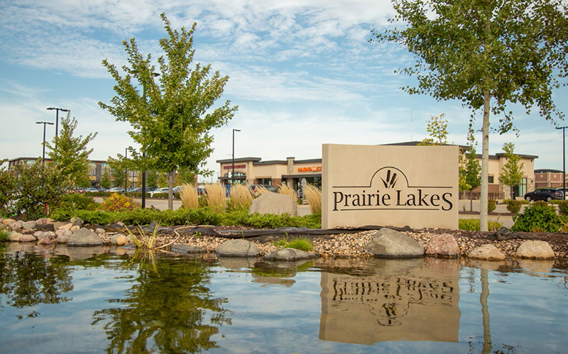 The welcoming City of Sun Prairie, a suburb of Madison, is the second-most populous city in Dane County, Wisconsin. Sun Prairie’s population of almost 35,000 is strong, resilient, and, remarkably, finds a way to let in the sunshine even on the darkest days. The City’s early history hearkens back to 1837, when a party of 45 men was commissioned by President Martin Van Buren to build a capitol for the Territory of Wisconsin in Madison. The group traveled for two miserable weeks in the rain before emerging at the edge of the prairie where the sun shone down for the first time in days. In testament to the event, they carved the words "Sun Prairie" into a tree. Two years later, Charles Bird returned to the area and became the first settler. The Town of Sun Prairie was first created on February 2, 1846 and incorporated as a city in 1958. Fast forward to July 10, 2018 – a horrific gas explosion leveled a downtown city block, destroying a bar and a pizza restaurant, as well as damaging the historic old city hall and several other nearby buildings. Bar owner and Fire Captain, Cory Barr, was injured in the explosion and died as a result not long after. Showing true unity of spirit, caring citizens and companies around the area came together with fundraising campaigns in support of the Barr family and the affected businesses. Today, the tagline "Sun Prairie Strong", a slogan which arose after the tragedy, still resonates as a symbol of the City's strength as a community. Neil Stechschulte, Economic Development Director for the City of Sun Prairie recalls, “Two years ago, we had a massive natural gas explosion in our downtown that destroyed six buildings and one of our firefighters lost his life. It was devastating to the community. I live a half mile away, and when it happened I thought a car had gone off the road and hit my house. That’s what it felt like. Since then, we’ve undertaken a major redevelopment project for that area. The planning process is finished and now we’re working on getting some redevelopment started on that site. It’s obviously a huge focus for us. We engaged a consulting planner to work with the community and talk to the stakeholders and property owners to see what they’d like to see down there.” The redevelopment plan is being regarded as a 100 to 150 year decision – whatever is rebuilt there will remain for a long time. The site is a prominent intersection, with a few key property owners in the area. According to Stechschulte, “The explosion happened right across the street from our old city hall, which is on the National Register of Historic Places. The blast knocked the roof off center and there was a lot of external damage to the building. The owner had just bought it a month before the explosion. He’s now kicking off a huge restoration project and we’re evaluating a request that will help restore it to the way it looked in 1912. We’re excited about that, it’s a landmark on that corner. The plan, called ‘Sun Prairie Stronger,’ drives much of the building scaling and the architecture around that historic building and how tall it will be. And we hope it sets the tone for the rest of the area.” The full redevelopment plan was created with input from the current property owners, and they are encouraged to bring forward a project that matches what is in the document: increased density, more mixed-use, somewhat taller structures – the corner is at the main intersection where the state highway turns and comes right through the downtown. With its location on a highly visible, high-traffic route, the project will be a top community priority for the next several years. Sun Prairie has also been busy in other avenues. Two new elementary schools were recently built and are now open. And site work is underway on another high school. “Since we first decided to build a second high school, that’s been a big deal for the community,” says Stechschulte. “We’ll be the first community in Dane County outside of Madison that has two high schools within our own district. They made an interesting decision to maintain the existing football field that is kind of historic, and redevelop it for both high schools. So, eventually, there will be football going on every Friday night in the fall.” Roadwork is always on the list, and a stormwater facility project is on tap but the start has been delayed because the City had to purchase more land than was needed for the pond and they’re trying to sell some of the excess for commercial development. Stechschulte admits, “Working with the developer on that has taken a bit longer than expected, but we have an anchor tenant and we’re just figuring out all the complexities. Normally the City will just buy the land, design the project, bid the project, and build the project. Well, now we have another partner that we have to take care of, too. So there are a lot of details, but we hope it will happen this fall or the spring of 2021 at the latest.” Sun Prairie also boasts a new business park, Park 151, with 700,000 sq. ft of higher-end industrial and office space – a first for the City. A pair of 100,000-sq.-ft buildings are already up and available for lease. One is pretty much full, the second is opening soon for occupancy. An additional building has been sold to Sani-Matic, Inc. – a manufacturer of industrial sanitation equipment. Within the existing traditional Business Park, Imperial Blades was acquired by Milwaukee Tool and is undergoing a major expansion project at their location. The park has had some issues. Of note, Riddell, the football helmet company, acquired a local company for uniforms and built a beautiful 110,000-sq.-ft facility for production. After two years, a corporate decision was made to sell off the business line and the new owner moved the operations elsewhere. As a result, Sun Prairie now has a brand new industrial building right on the edge of town that is available for lease by Riddell. “That was an unanticipated challenge for the City,” says Stechschulte, “but we’re working with them on it. We’d like to see that building occupied by the end of this year or next spring. In other news, the Hilton Garden Inn is open and offers a great event/meeting space. The new Menard’s Home Improvement retail store is open. And the new Full Mile Beer Company & Kitchen in our downtown has a brewery on the first floor and an event venue on the second floor and a rooftop garden area. It’s open and doing quite well, while under the current COVID-19 restrictions.” Affordable workforce housing for those making less than 60 percent of the Dane County median income is important to the community. Two projects have been built in the original traditional main street corridor, adding 140 to 150 units of workforce housing. Stechschulte shares, “With the City taking on an increasing interest in affordable housing, we were actively looking for a development partner who could bring us the right type of project with the best chance of being successful. When Gorman & Company proposed their Eleven41 project on Main Street, we knew they had an excellent project resume as a developer, and an equally great reputation as a project manager. Their knowledge, experience, and professionalism was outstanding, and they were great to work with. We are confident that the Sun Prairie housing market would welcome another project from Gorman.” The City is now evaluating another new project on central Main Street as a redevelopment project at the predominate corner of Main and Bird Street for 100 units of senior housing in that same income category. In addition to Sun Prairie’s unique manufacturing businesses, technology-driven businesses are also producing amazing products. And on the west side of town are all the big box retailers that have opened in the last 10 years. “Growth has been phenomenal,” says Stechschulte. “We’re one of the fastest growing cities in Wisconsin, projected to hit a population of 50,000 in the next five to ten years. Even with the pandemic, our single family home building permits this year are higher than last year. We’ve had a very successful historic downtown for a long time. And despite what’s happening, it’s still doing well. We’ve been incredibly resilient. Those folks down there have had a double whammy the last couple of years – losing the highway for an entire summer of business and the impact of being under construction. Now they’re dealing with COVID-19. Yet, we’re doing good – not a lot of vacancies. And the people are still hanging in. That’s what makes Sun Prairie a great place.”