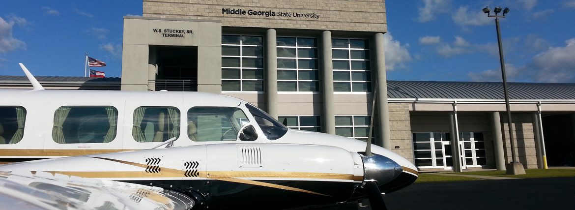 The Heart of Georgia Regional Airport is located three miles east of the City of Eastman in South Central Georgia, and services general aviation air traffic from all over the southeast United States. The Airport was originally built by the State of Georgia for the Stuckey’s Corporation to support its business operations. “Mr. W.S. Stuckey, who started the candy company here in Eastman, Georgia, selling pecan log rolls by the side of the road, kept expanding and started putting stores all up and down the Interstate,” explains Airport Manager, Jeff Fordham. “They had a Piper Aztec, and their airstrip was not long enough, so they came out here and built the Airport because they needed a place to land their bigger planes.” When the facility was officially dedicated in December 1966, then Governor Carl Sanders hailed the $232,000 Eastman-Dodge County Airport as “the first community airport in Georgia that we have built specifically to accommodate the modern business jet airplanes that are becoming so important in one industry after another.” Today, the Heart of Georgia Regional Airport is owned and operated by Heart of Georgia Regional Airport Authority and is overseen by a seven-member Board of Directors, made up of two members from the Eastman City Council, two members from the Dodge County Board Commissioners Office – one is a sitting board member from each of those, and one is an at-large appointment - and two members from the Dodge County-Eastman Development Authority – one is a board member, one is an at-large appointment. The seventh member is appointed by the Georgia House of Representatives. The Airport’s original 4,500-ft. runway was lengthened to 6,506 feet in 2004, and equipped with a precision instrument landing system and a landing capacity of 100,000 pounds. A new terminal and tower were completed in 2005. The Airport supports between 300-400 operations per day, comprised of general aviation, corporate, military, flight training, customs and border patrol, air ambulance, and aerial agricultural traffic, making it the 5th busiest take-off and landing airport in the state. Over the last several years, the Heart of Georgia Regional Airport has also become a major aviation education presence in the Southeast. It is home to Middle Georgia State University’s Aviation Center – Georgia’s only state-supported aviation center – which trains pilots and airport and airline management majors, while giving airframe and power plant students the skills required to build and maintain aviation assets. The school’s flight program is FAA-approved, and its campus at the Airport is home to a fleet of 30 airplanes, four helicopters, and several advanced simulators used in training and instruction. In 2007, the school’s Air Traffic Control Management program was named the top new ATC program in the nation by the FAA. The Airport is also home to several aviation manufacturing and maintenance firms. Fordham Aviation Inc. provides aircraft maintenance services; KENCOA Aerospace LLC is a premier Tier-1 supplier of multi-axis precision machined and sheet metal fabricated aerostructures, jet engine components, and major assemblies for commercial, military, and business/regional jets, worldwide; AREMAC Heat Treating East, LLC, is a nationally recognized heat treatment company; and Valence Surface Technologies is a full-service metal finishing company for the aerospace industry. Machining, heat treatment, and finish coating, located next door to each other on the same airport – a unique capacity that isn’t repeated anywhere in the country – means a much faster turnaround for parts manufacturing and final delivery to companies such as Boeing, Airbus, Lockheed-Martin, Gulfstream, and Sikorsky. All of this activity means that the Heart of Georgia Regional Airport plays a vital role in supporting the region with 376 jobs with an annual payroll of $14,700,000, and $37,169,000 in economic output for the local and regional economies. As airport tenancy continues to grow – there are currently around 60 private and corporate home-based aircraft on property - Fordham says that he would like to see more hangars built by private developers - as opposed to the county footing the bill. “Right now, everything is owned by the Airport and rented out. We have 18 hangars and they’re all full. There’s a lot of land on the west side of the airport; most everything has been developed on the east side. I think there’s a couple of hundred acres, at least, that’s available to develop with more to be obtained if we need it,” he notes. “We’re getting ready to do an apron re-hab project – we’re still working on the cost for that; it should be somewhere around a million dollars. We also want to put in a taxiway into an area where we can build more hangars or have ground leases so others can build hangars. I think it’s better if people build their own hangars.” Fordham says that the Airport’s 6,506-ft. runway is currently able to handle any normal traffic. “There was some talk about lengthening the runway, but we haven’t gotten that solidified yet,” he shares. “Right now, we’ve got a very good runway with two parallel taxiways and the pavement is in pretty good shape. So, I don’t foresee having any resurfacing projects within the next five years or so.” Regarding any potential competition from nearby airports, Fordham says that Heart of Georgia has lots of services available that one wouldn’t necessarily find elsewhere. “We have everything from catering, to courtesy cars, to 24-hour fuel availability for jets and pistons,” he reports. “And our normal operating hours are a little bit longer; we’re open 8-5 Monday through Saturday, and 12-5 on Sunday. And we don’t mind staying till seven or eight o’clock at night if we need to. A lot of airports, after a certain hour, you can’t get anybody; but we’re pretty much available 24/7 if anyone calls. With COVID, we had to cut back on our hours, but we try to pride ourselves on our accessibility and our customer service.”