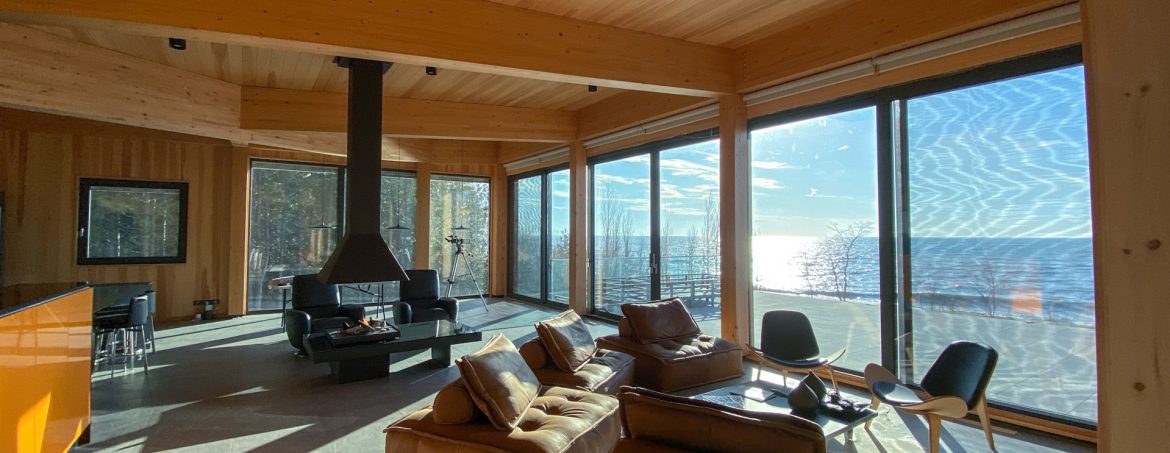 Element5 room showing wood and large glass doors with a view.
