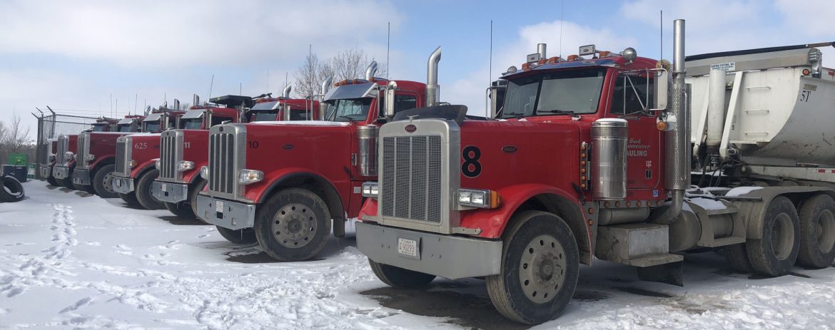 Linaweaver Semi trucks in a row in snow.