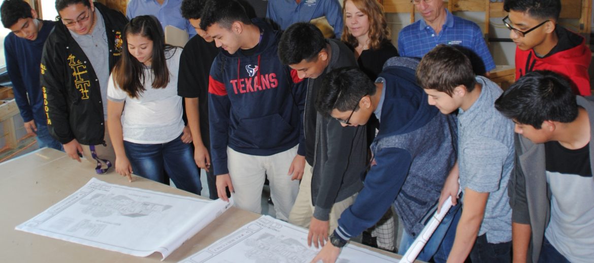 Greater Houston Builders Association (GHBA) people looking at plans on a table